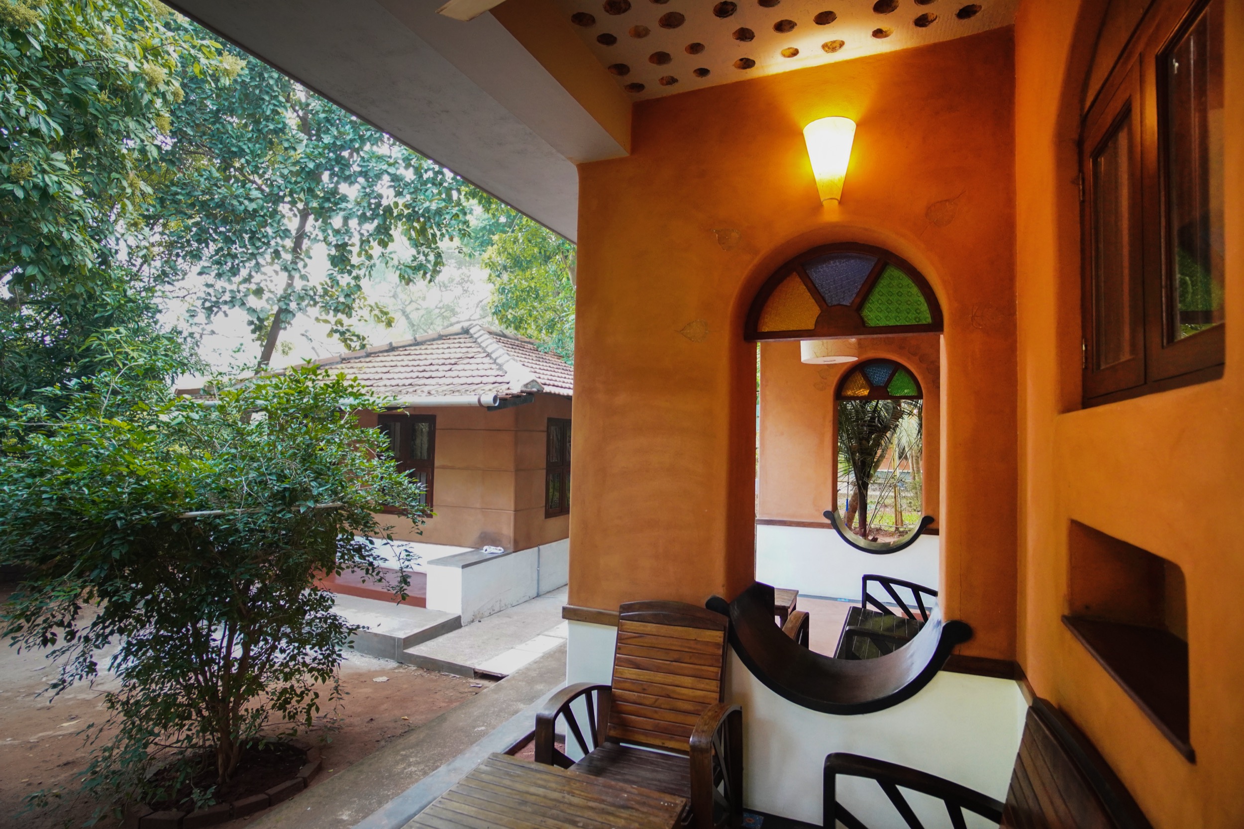 Tropical green garden view from the porch at Anpu cob retreat near Pondicherry